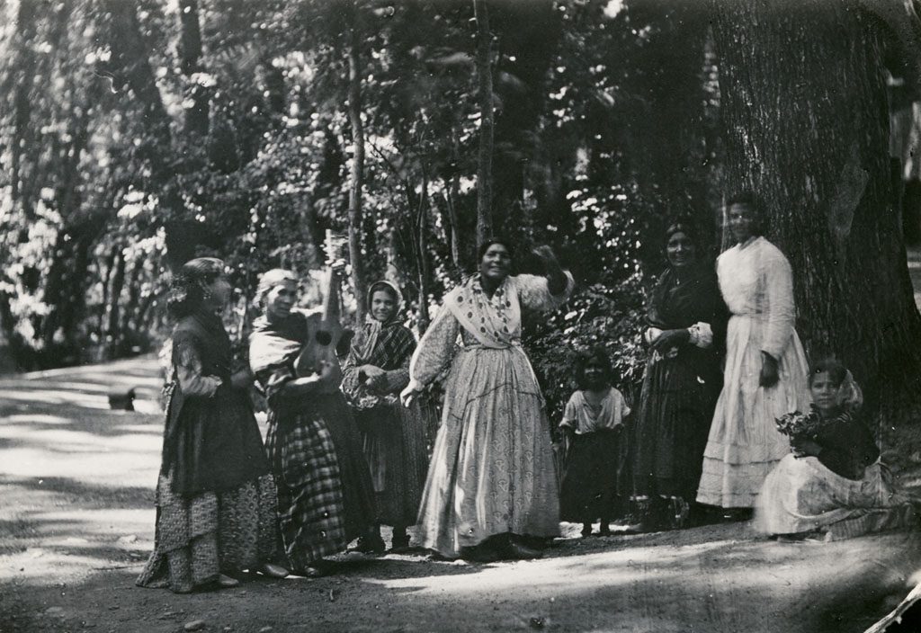 Group of Romani women and children in the Alhambra Forest in Granada, Andalusia